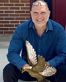 Tim Schmalz with Sheltering Sculpture at DePaul Society in Macon, Georgia.jpg