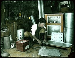 Tinsmith at work. (19942316042).jpg