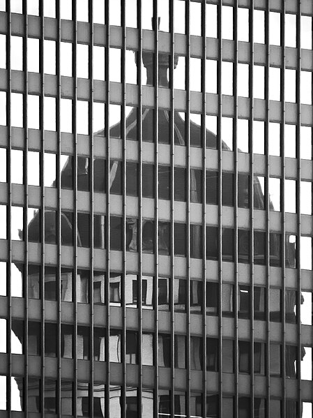 Top of the Keenan Building reflected in a modernist skyscraper