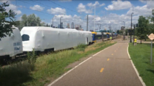 Two Type III LRVs coupled to three Type II LRVs while being accepted by Metro Transit in summer 2020. Type III LRV being delivered.png