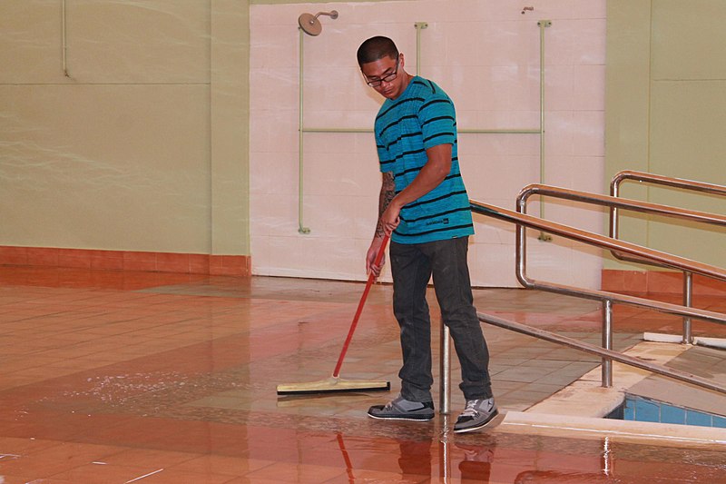 File:U.S. Navy Sonar Technician 3rd Class Derrick Reyes, assigned to the guided missile destroyer USS Higgins (DDG 76), sweeps a pool deck during a community relations event at the Bahrain Mobility International 130617-N-UP025-004.jpg