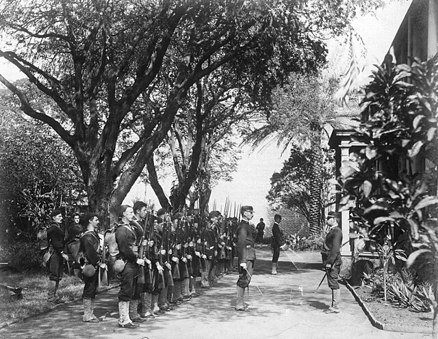 The USS Boston's landing force on duty at the Arlington Hotel, Honolulu, at the time of the overthrow of the Hawaiian monarchy, January 1893. Lieutena