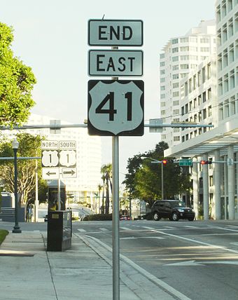 Southern terminus of US 41 at Brickell Avenue in Miami. The US 1 signs in the background are outdated, as US 1 has been rerouted on to Biscayne Boulevard.