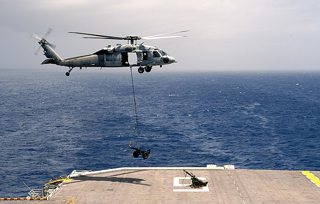 USMC M327 mortar air lifted onto Bataan's deck by MH-60S Seahawk on 7 June 2006