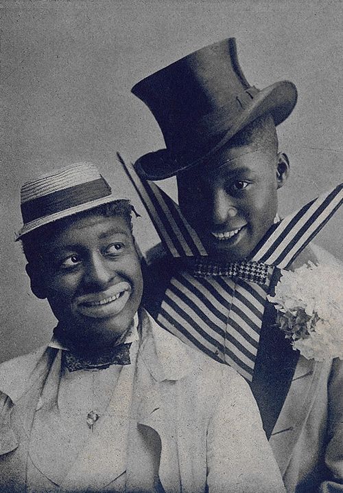 Vaudeville performers Bert Williams (left) and George Walker in blackface and comic outfits.