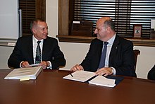 Weatherill meets Deputy Foreign Minister of Greece Konstantinos Tsiaras in a 2013 Australian visit. Taxidi UPhUPEKs K. Tsiara se Australia (8539862252).jpg