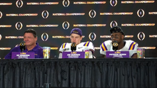 Burrow (center) with LSU head coach Ed Orgeron (left) and linebacker Patrick Queen (right) at LSU's 2020 National Championship post-game press event 2020-0113-OrgeronBurrowQueen.PNG