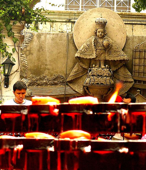 File:A set of burning candles during Santo Nino worship, Infant Jesus of Prague idolatry in Cebu Philippines.jpg