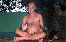 Monk sitting cross-legged on the floor