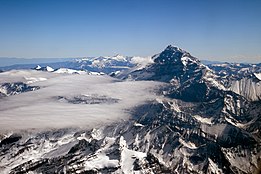 Mountain tops, with clouds shown.