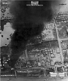 An aerial reconnaissance view of a burning Esso Shell oil storage tank, Phnom Penh, 17 April 1975 Aerial reconnaissance view of burning Esso Shell oil storage tank, Phnom Penh, 17 April 1975.jpg