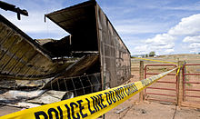 Police tape marking off a crime scene Airmen team up to build shelter 120413-F-UP124-080.jpg