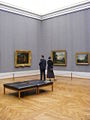Alte Pinakothek − Visitors watch paintings.JPG