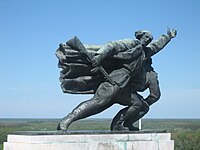Detail from the Batina monument which represents Yugoslav partisan going to battle Batina2.JPG