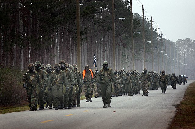 US Naval Construction Battalion NMCB-1 (US Navy Seabees) marching in route.