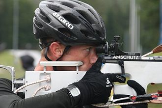 British biathlete Ben Woolley firing with his Anschutz Fortner biathlon rifle during a summer biathlon training in 2008 or 2009. Ben Woolley.jpg