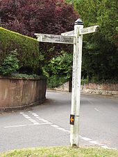 A fingerpost at Betchworth, Surrey. The additional orange arrow shows the route of a cyclosportive. Betchworth Fingerposts (geograph 3017403).jpg