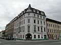 Apartment house in a corner and closed development