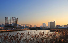 Bow Creek at high tide with a view towards Balfron Tower and Canary Wharf