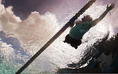 Chuck Sketch, a Wounded Warrior with the veteran swim team, swims laps during a practice session 120214-M-YO938-177