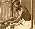 Closeup of a man operating a silk loom at Ghotal in Medinipur, Bengal - 1873.jpg