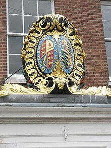 The arms of alliance of Queen Victoria, to the left, and Prince Albert of Saxe-Coburg and Gotha, to the right. Coat of arms at Portsmouth Dockyard, Hampshire.jpg