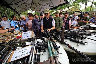 Members of the government cabinet inspecting weapons retrieved by security forces from ASG-Maute militants. Confiscated Weapons Marawi crisis June 2017.jpg