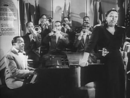 Waters performs with Count Basie in Stage Door Canteen (1943)