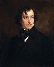 A young man of vaguely Semitic appearance, with long and curly black hair