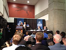 Athletic director Cheryl Levick trades helmets with Sun Belt commissioner Karl Benson at the Georgia Dome on April 9, 2012 GSUintoSunbelt.JPG