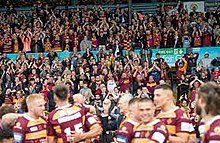 Huddersfield Giants players and fans celebrate reaching the 2022 Challenge Cup Final, Elland Road, Leeds, May 2022 Giantssemifinal.jpg