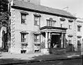 The building when it was Alida Harper Fowlkes' Georgian Tea Room during the 1930s and '40s. The portico and the section just visible to the right were added around 1820. Photographed by Frances Benjamin Johnston