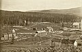 Hattfjelldal kyrkje (1868) under bygging, eldre kyrkje t.v.