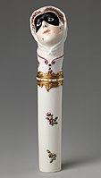 "Toy" needlecase with the head of Columbina, c. 1760, height: 4 7/8 in. (12.4 cm). Inscribed on enamel band on mount: NE SOYEZ POINT CRUELE ("Don't be so cruel")