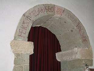 Her swutelad seo gecwydraednes de
('Here is manifested the Word to thee'). Unique Old English inscription over the arch of the south porticus in the 10th-century St Mary's parish church, Breamore, Hampshire Her swutelad seo gecwydraednes de.jpg