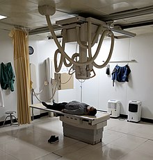 Patient undergoing an x-ray exam in a hospital radiology room. Hospital Radiology Room Philips DigitalDiagnost Digital Radiography System.jpg