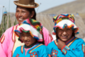 Indigenous mother from Bolivia with her daughters.png