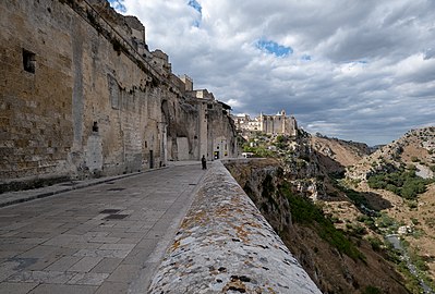 Jules and Gabriel at Sassi di Matera with the Convent of Saint Agostino on the background, Matera, Italy