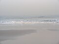 White sand beach viewed during sunrise.