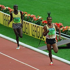 Image 10Kenenisa Bekele leading in a long-distance track event (from Track and field)