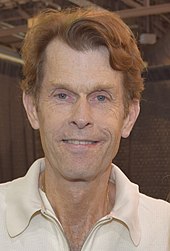 Kevin Conroy portrays a Boston Red Sox player Darryl Mead, whom Carla dates in "The Ghost and Mrs. Lebec" after her husband Eddie's death. Kevin Conroy (17612441638).jpg