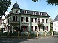 Sankt Hubertus: tenement house with fencing in a corner