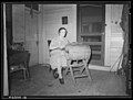Lancaster County, Pennsylvania. Mrs. Royer churning butter on back porch, Enos Royer farm, 1938 by Sheldon Dick.jpg