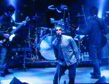 Oasis performing live at Shoreline Amphitheatre, Mountain View, California in September 2005 Liamg.jpg