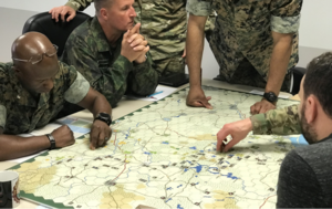 A wargame at the US Marine Corps War College (April 2019). MCWC-wargame-Lacey-13-cropped.png