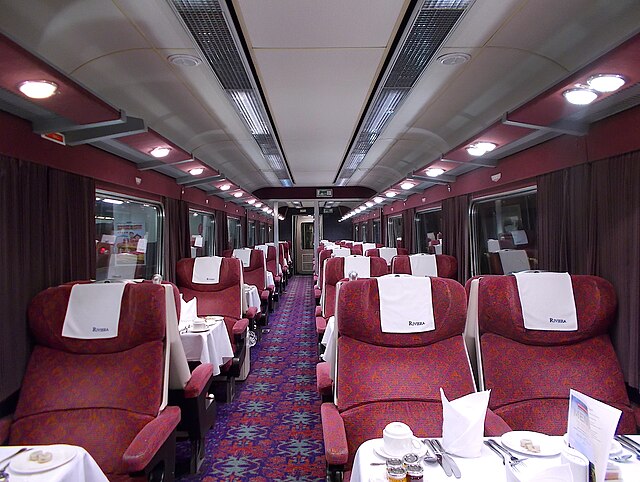 The interior of a Mark 2 Open First showing the former Virgin Trains West Coast Burgundy seat moquette trim