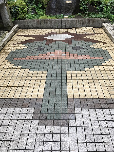 A mosaic of a kappa at a plaza in Kappabashi-dori, Tokyo, which appears as a central plot device in the series.