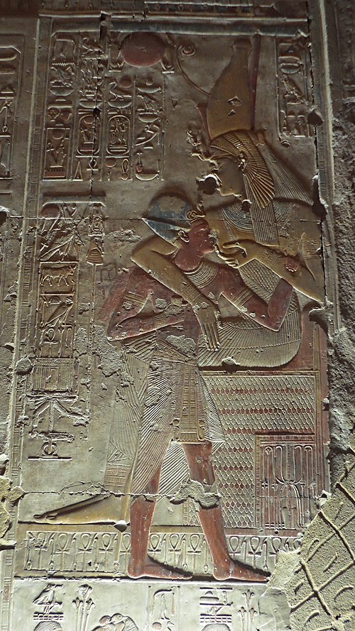 Mut nursing the pharaoh, Seti I, in relief from the second hypostyle hall of Seti's mortuary temple in Abydos.