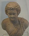 English: Bust of a boy. Pottery. Roman Period. 2nd or 3rd Century CE. עברית: פרוטומה של נער. צלמית חרס. התקופה הרומית. המאה השניה או השלישית לספירה.