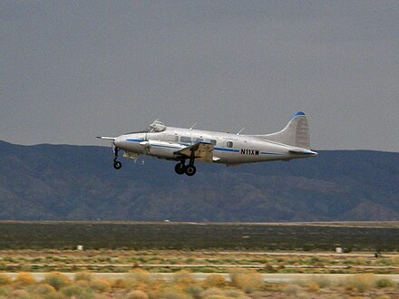 Dove 6A belonging to the National Test Pilot School departs the Mojave Airport